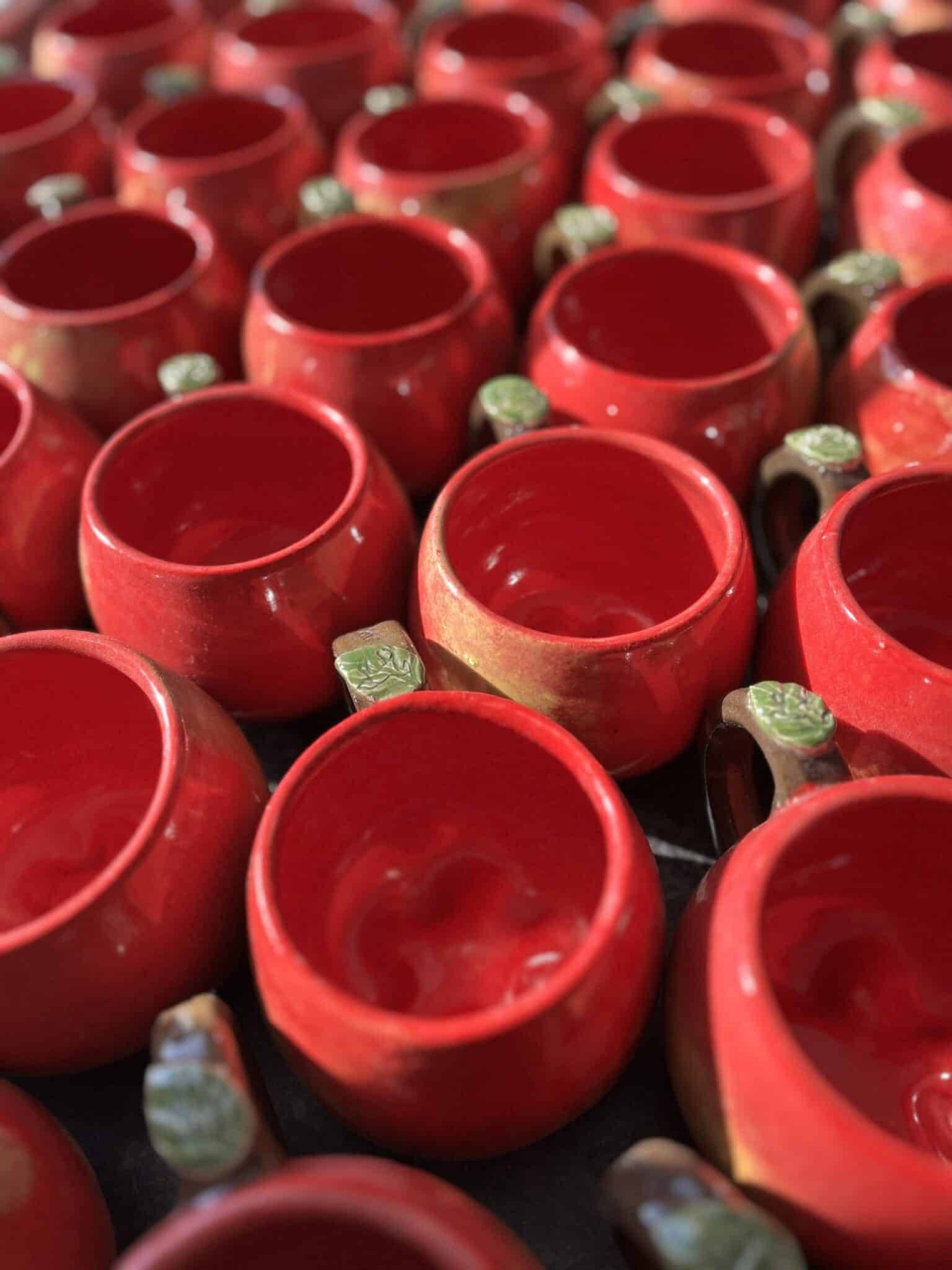 Many mugs, apple shaped, red, green leaf